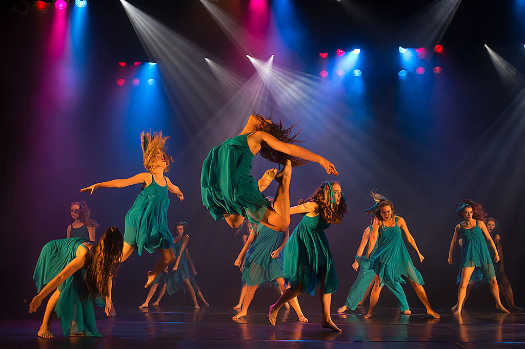 dramatic dancers jumping on stage